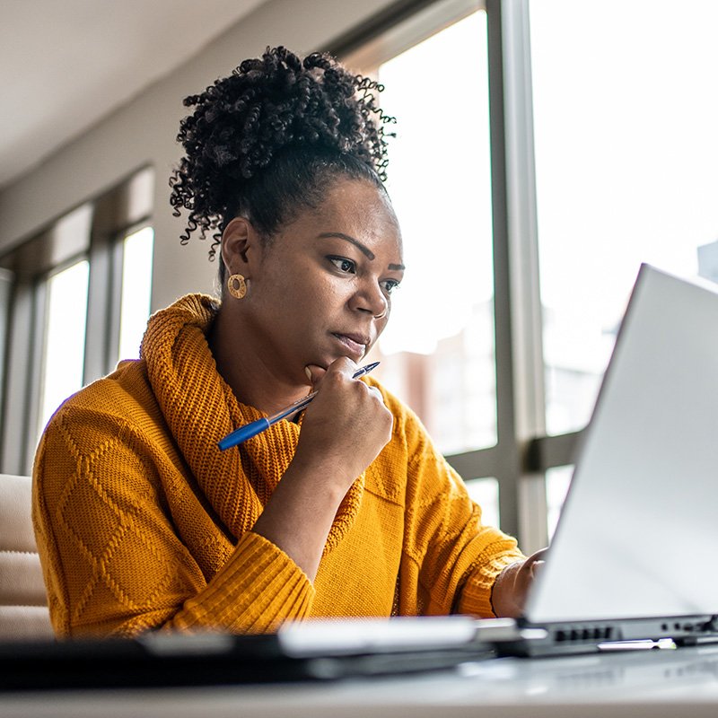 Person looking at data on laptop computer
